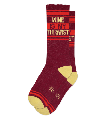 Crimson sock with "WINE IS MY THERAPIST" text, yellow toe, and red accents.