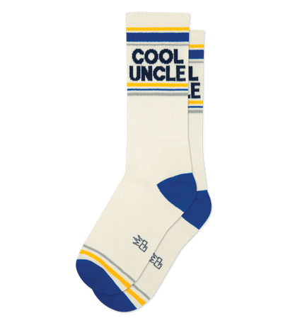 Alt text: Cream cotton socks with blue accents, featuring "COOL UNCLE" text and stripes at the top.