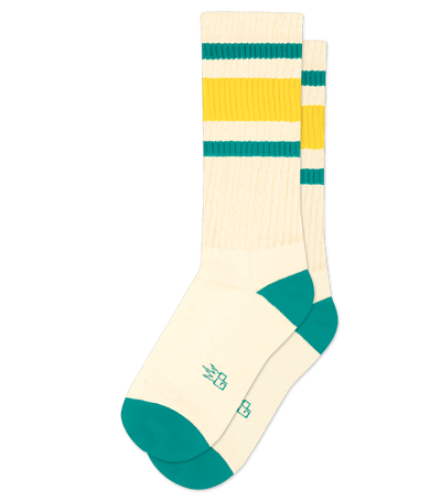 Pair of natural cotton socks with yellow stripes and teal accents, no background.