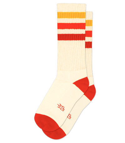 Natural cotton sock with red accents and striped pattern.