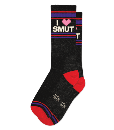 Black sock with neon pink accents and striped design, reads "I ♥ SMUT". Red heel and toe patches.