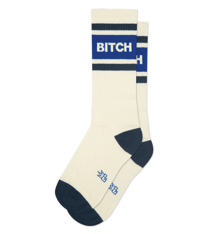 Cream-accented cotton sock with "BITCH" text in blue and cream stripes. Navy toe and heel detail.