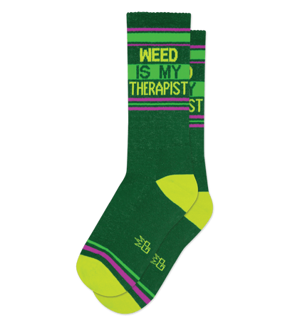 Dark green sock with "WEED IS MY THERAPIST" text and kiwi green accents, no background.