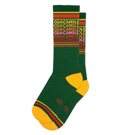 Dark green socks with gold accents; text reads "GUACAMOLE" in repeating multicolor design near the cuff.