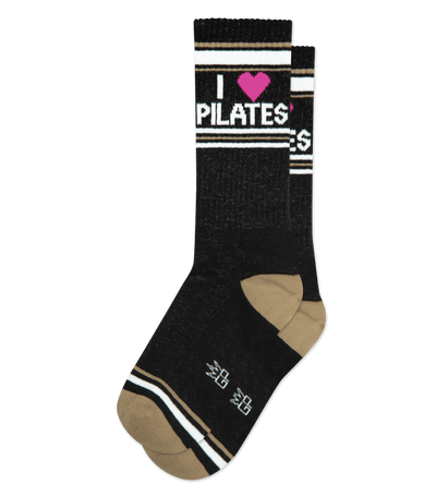 Black socks with ruby pink accents and "I ♥ Pilates" text. Featuring beige heel and toe.