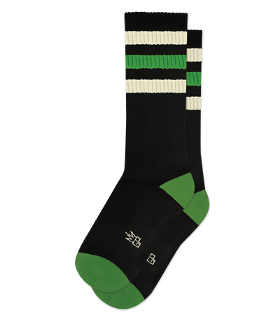 Black socks with green accents and cream stripes. Design includes geometric patterns near the top.