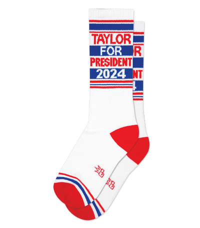 White sock with red accents featuring "Taylor for President 2024" text on leg.
