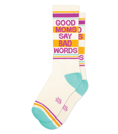 Socks with text "GOOD MOMS SAY BAD WORDS" in purple and yellow, light teal accents on toes and heels.